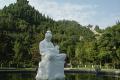 五龙峰景区是郑州黄河风景名胜区的中心景区，在五龙拱卫的山麓平地中，是繁花似锦的小花园，花园正中心矗立着一座汉白玉雕刻成的塑像——“哺育”。“哺育”塑像坐落于一个硕大的梅花池中央，高5米，重12.5吨，通体呈乳白色，“母亲”发束魏髻，身着唐装，怀抱甜睡的婴儿，形态凝重而高洁，表情安详而慈惠，她背依巍巍岳山，面向滔滔黄河，在壮丽山河的映衬下更显得端庄、惠美。“母亲”是黄河的象征，黄河是母亲的化身。塑像形象而生动地表达了黄河与华夏民族的血肉联系和母爱亲情。塑像主题构思奇妙，造型逼真，人物传神。“哺育”塑像曾作为省、市电视台的开播画面，走进了千家万户的荧屏，是景区的标志性塑像。